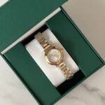 ساعة سيراميك ذهبي وفضي